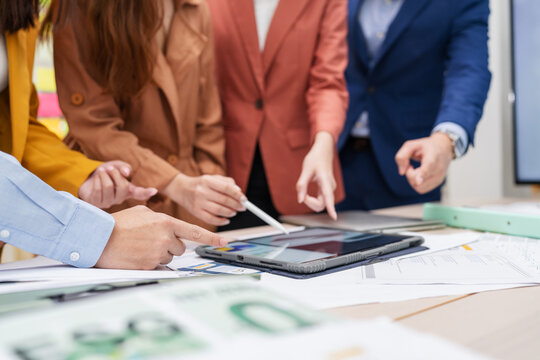 Business meeting showcases agile brainstorming with data analysis charts on tablets. Financial growth prediction strategy through predictive analytics and data-driven insights for strategic business 