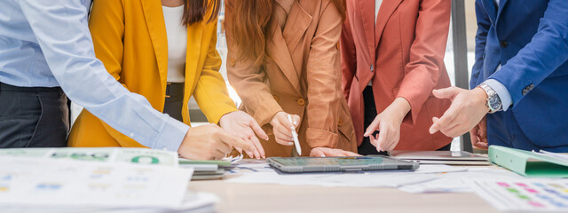 Business meeting showcases agile brainstorming with data analysis charts on tablets. Financial...