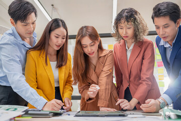 Business meeting showcases agile brainstorming with data analysis charts on tablets. Financial growth prediction strategy through predictive analytics and data-driven insights for strategic business 