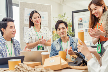 Creative ESG brainstorming session for earth friendly reuse recycle packaging campaign. Team...