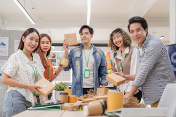 Portrait of creative ESG team brainstorming earth-friendly reuse recycle product packaging campaign. Sustainable business meeting focuses on environmental social governance for viral climate action 