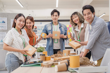 Portrait of creative ESG team brainstorming earth-friendly reuse recycle product packaging...
