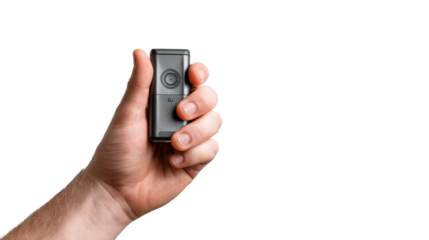 Hand holding a portable voice recorder, isolated on a white background.