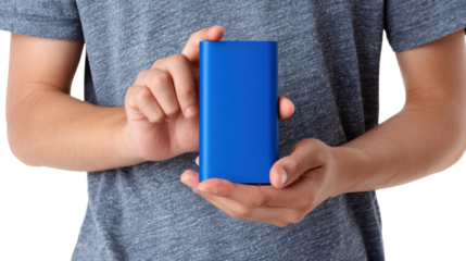 Man holding a blue portable charger in hands, isolated on white background.