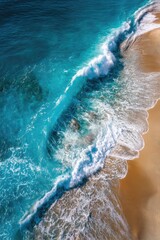 Fototapeta premium Azure waves crash on golden shore