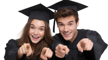 Two joyful graduates celebrating success and pointing forward, isolated on a white background.