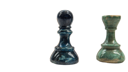 Two unique ceramic chess pieces with distinct designs on a white isolate background.