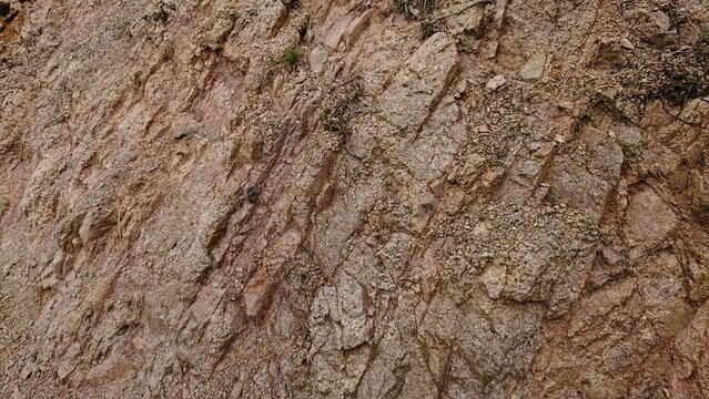 Light Brown Rough Rock Wall Texture With Sand and Dirt Stone - Detailed Mountain Nature Surface Material Texture Background Picture in JPG Format