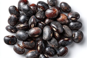 Obraz premium Dark beans clustered on white background
