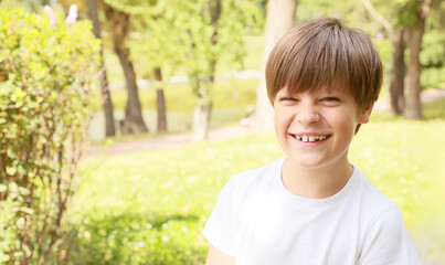 Joyful Boy Enjoying a Sunny Day in the Park Surrounded by Nature and Laughter, Showcasing a Moment of Carefree Happiness and Childhood Delight