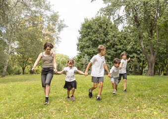 Children Joyfully Playing Together in a Sunny Park During a Delightful Summer Afternoon Filled With Laughter and Friendship