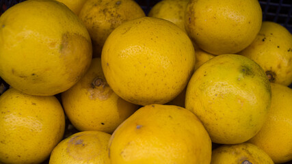 A photograph of lemons sold in a market. Taken from Las Pinas, NCR, Philippines. 