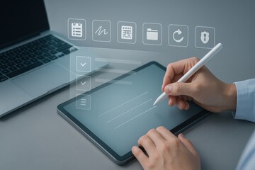 A person signs a digital document on a tablet computer, supported by an open laptop, featuring a transparent interface with various digital symbols.
