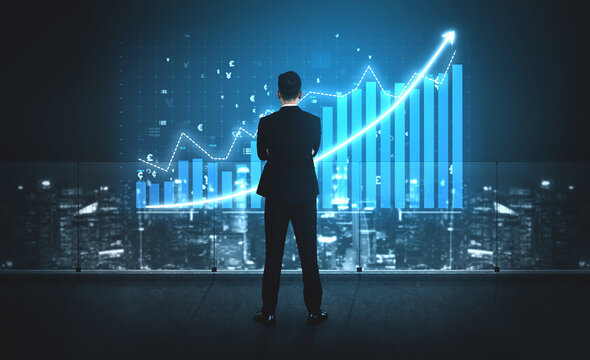 A businessman stands confidently in a modern office, analyzing a growth graph against a stunning urban night backdrop, symbolizing success and strategy. Impute