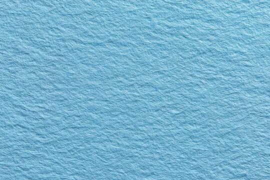 Blank light blue paper texture suitable for various design applications including backgrounds, stationery, or artistic projects