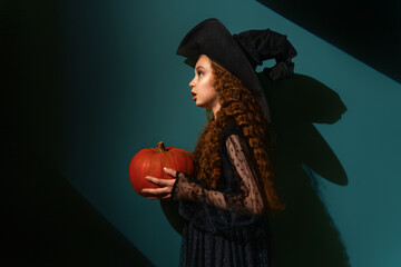 girl with Halloween pumpkin