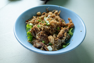 A different version of the famous phad thai but with flat noodles and chicken slices at Bangkok