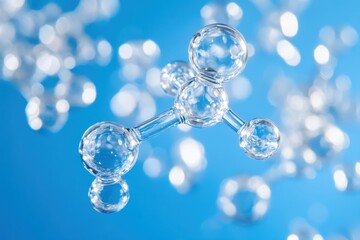 
Models of hydrogen molecules floating against blue background - H2 scientific element