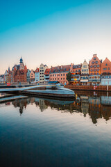 Obraz premium Gdansk with Motlawa river in Poland. Old town colourful house with Holy Spirit Gate