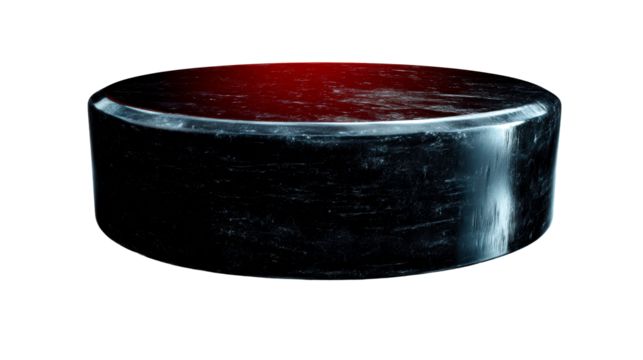 Black hockey puck with scratched surface and red light accent, cut out transparent