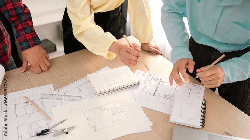 Aufkleber architect and safety engineer discussion about building blueprint displaying on laptop on table usin