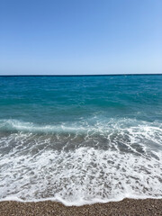 blue sea waves on a sunny day at the beach