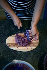 Freshly Shredded Purple Cabbage on a Wooden Board