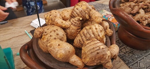 Close up of Temu Lawak roots on wooden plate