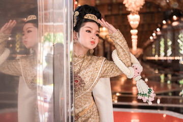 Traditional Dancer Posing Elegantly in Decorative Temple Setting