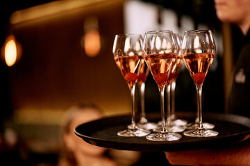 Elegant Tray of Sparkling Cocktails Served at a Sophisticated Gathering