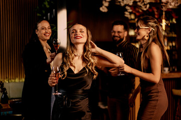Friends Enjoying Social Gathering With Drinks in a Stylish Bar Setting
