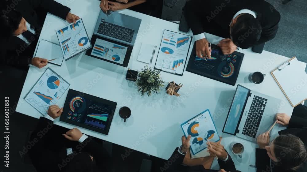 Poster top down aerial view of business people discussing about financial strategy on table with document a