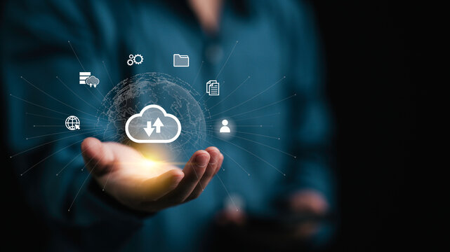 Businessman using Cloud computing and data backup to document management and digital files storage and transfer. doc sharing, file access, and sync data, online documentation database technology. - Powered by Adobe