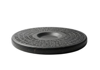 Dark charcoal grey stone disc artifact with ancient script etchings and a recessed basin, on a transparent background, soft shadows, museum exhibit photography, profound ancient mystery concept