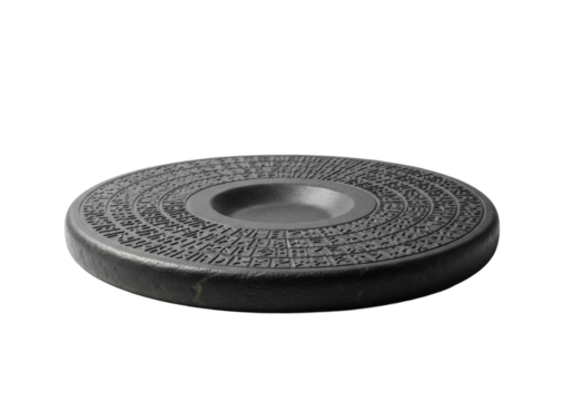 Dark charcoal grey stone disc artifact with ancient script etchings and a recessed basin, on a transparent background, soft shadows, museum exhibit photography, profound ancient mystery concept