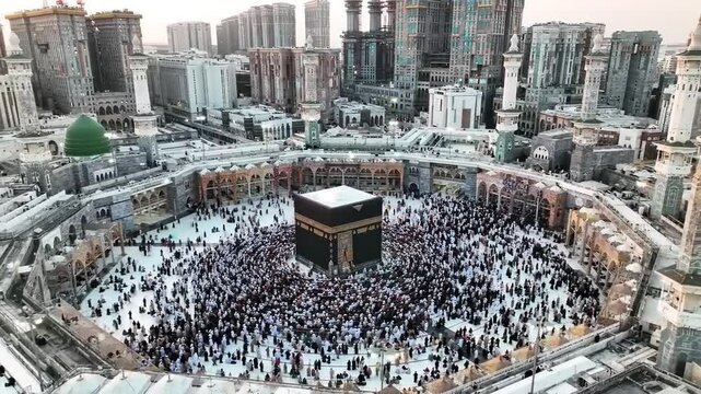 Aerial view of thousands of pilgrims circling the Kaaba during a spiritual gathering in Mecca