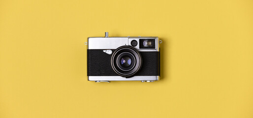 Flat lay, vintage film camera on pastel background, photography minimal idea.
