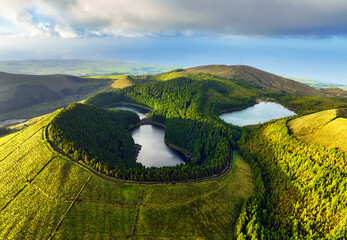 Aerial view of beautiful lagoon in the Azores islands. Drone landscape view with lines and textures in the background. Top view of volcanic crater, tourist attraction of Portugal.