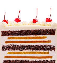 Layered chocolate cake with cherries on top in a bright setting