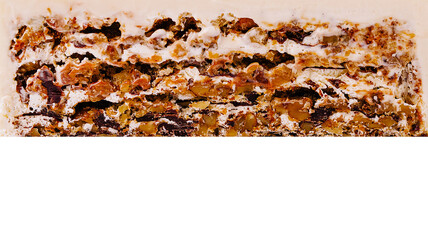 Decadent layered dessert with nuts and caramel on display at bakery shop