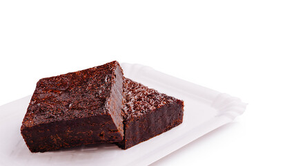 Delicious chocolate brownies served on a parchment paper