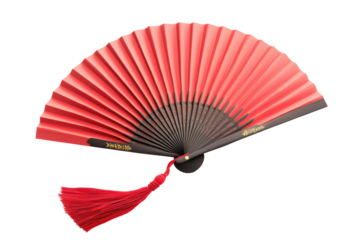 Red and black japanese folding fan with tassel isolated on transparent background. Red paper fan adorned with a tassel elegantly displayed isolated on white background.