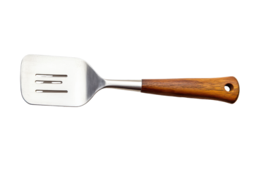 Stainless steel spatula with wooden handle isolated on transparent background. Spatula with a wood handle and stainless steel head perfect for versatile cooking tasks isolated on white background.