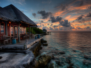 Fototapeta premium Seaside Resort Deck at Sunset with Vivid Colors over Calm Waters A Tropical Vacation Paradise Dream