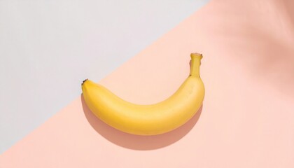 Single Banana on Light Gray and Pink Background