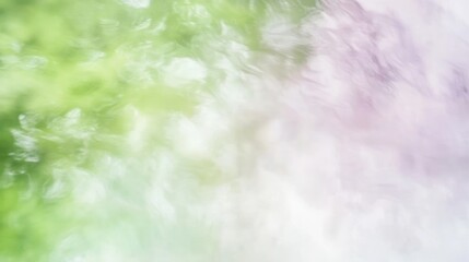 Abstract dreamy background with blurred motion effect featuring pastel colors like green and