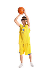 Fototapeta premium Sporty young Asian man in AR glasses playing basketball on white background
