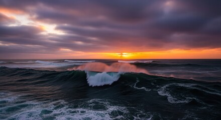 Dramatic stormy ocean waves crashing at sunset with vibrant orange sky and dark clouds