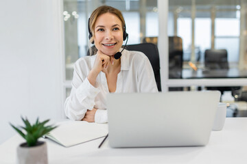 Young confident business woman having a call and looking involved