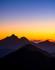Fototapeta premium Mountain silhouettes at sunrise